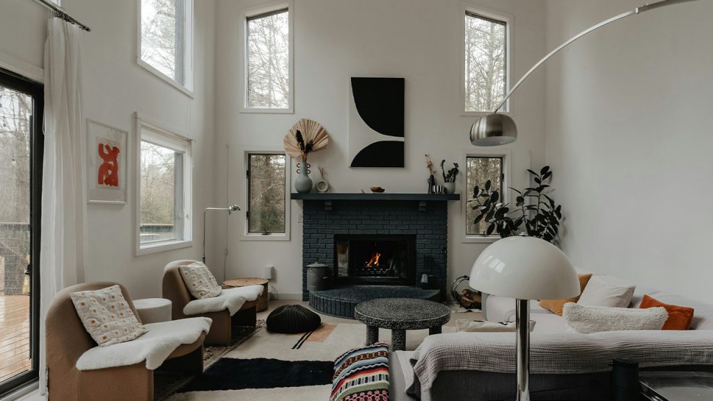 a living room filled with furniture and a fire place