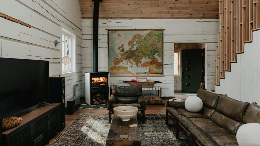 a living room filled with furniture and a fire place