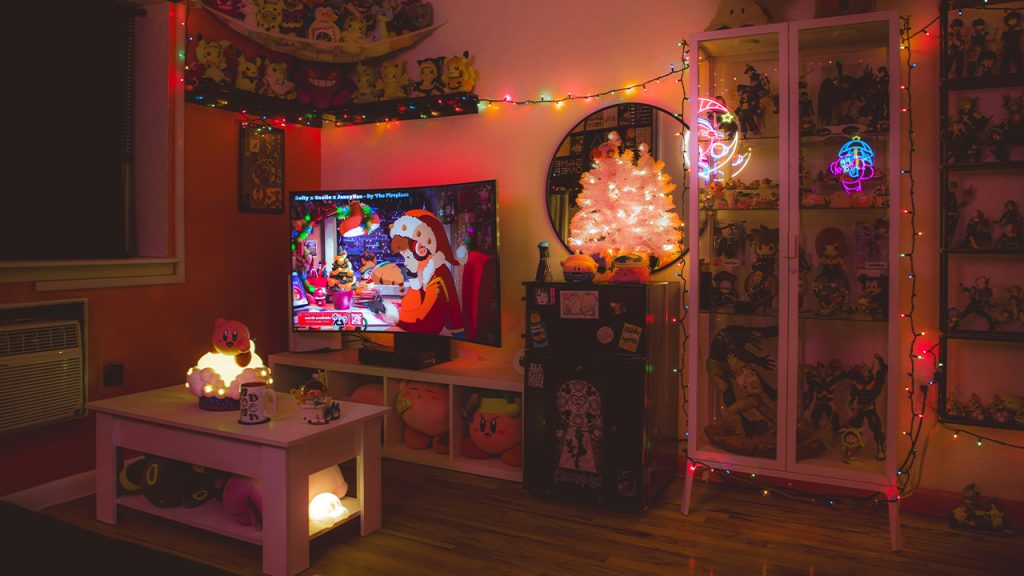 a room with a tv, shelves, and a lot of toys