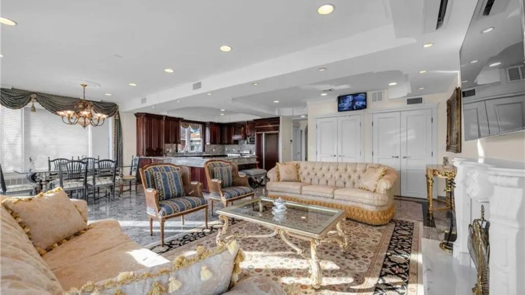 Elegant open-concept living space with classic European décor and a luxurious kitchen.