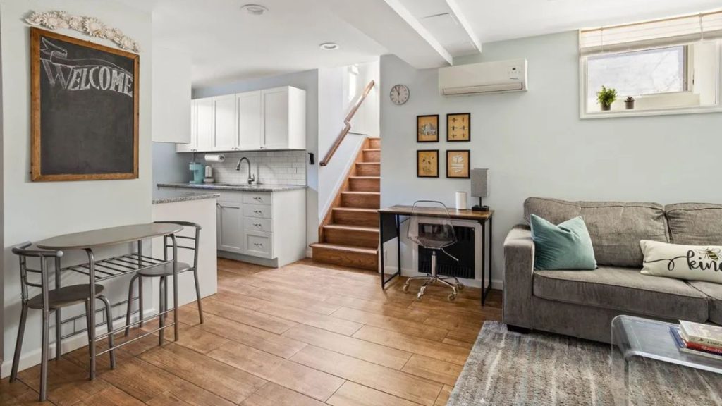 Open-concept living space with a kitchen, small dining nook, and cozy seating area.