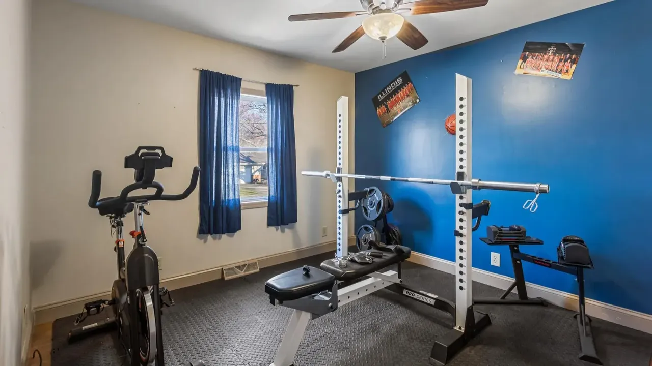 1978 Bi-Level Mahomet Residence With Remodeled Primary Suite and Wet Bar Lounge (With Floor Plan).
