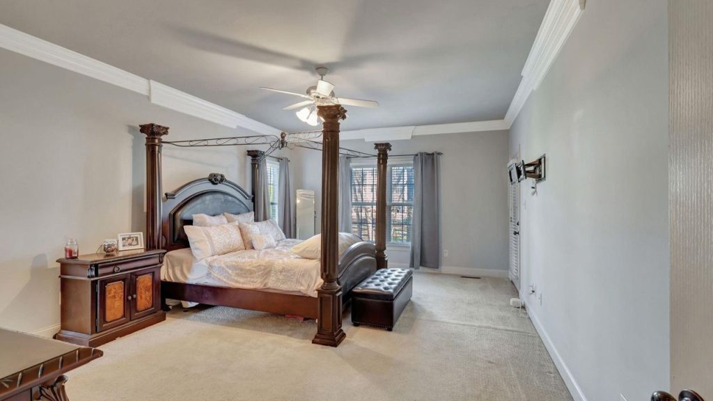 Primary Bedroom and Kitchen