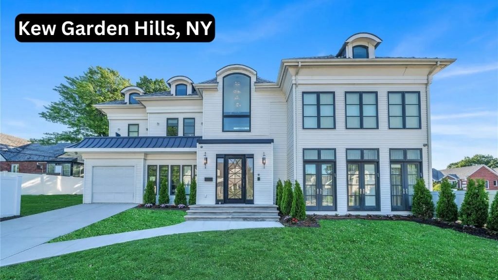 Elegant modern home in Kew Garden Hills, NY, featuring black-framed windows, a grand entrance, and a manicured lawn.