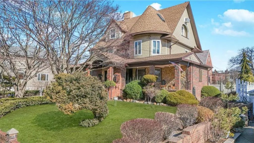 Classic house with a landscaped front yard and a welcoming porch.