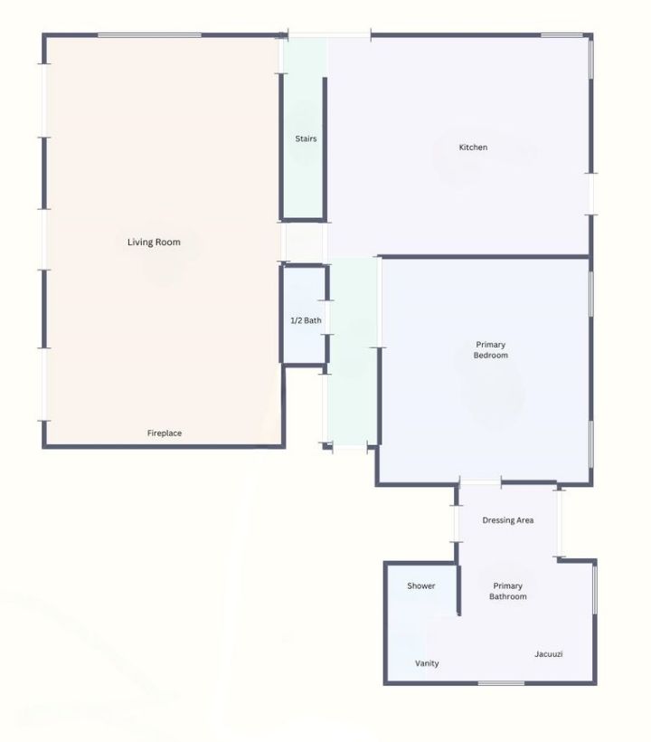 A floor plan featuring a living room, kitchen, primary bedroom, and ensuite bath.