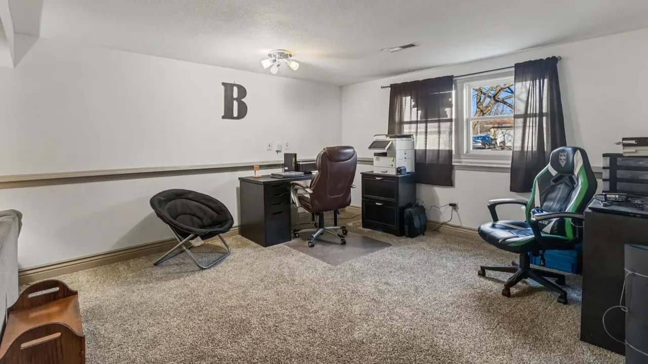 1978 Bi-Level Mahomet Residence With Remodeled Primary Suite and Wet Bar Lounge (With Floor Plan).