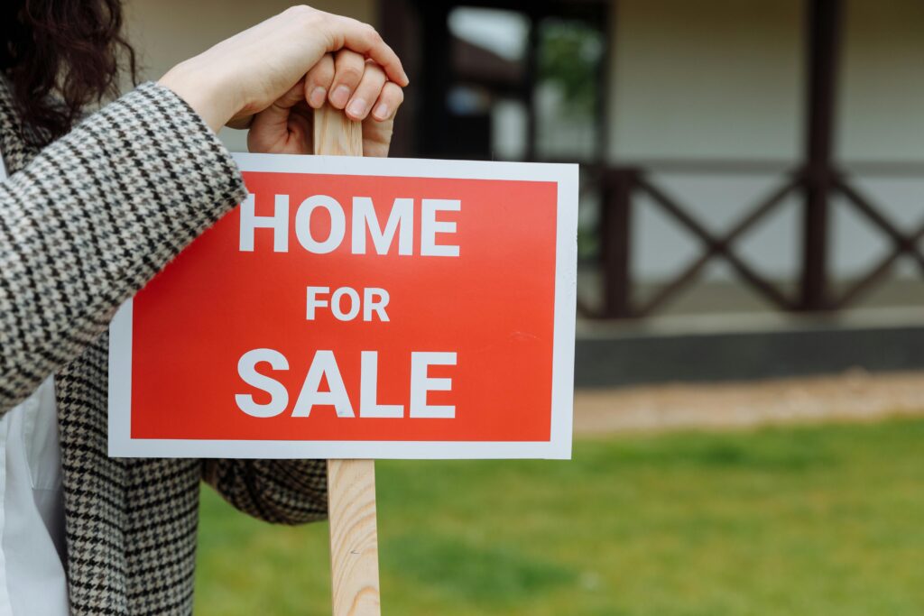 A 'home for sale' sign.