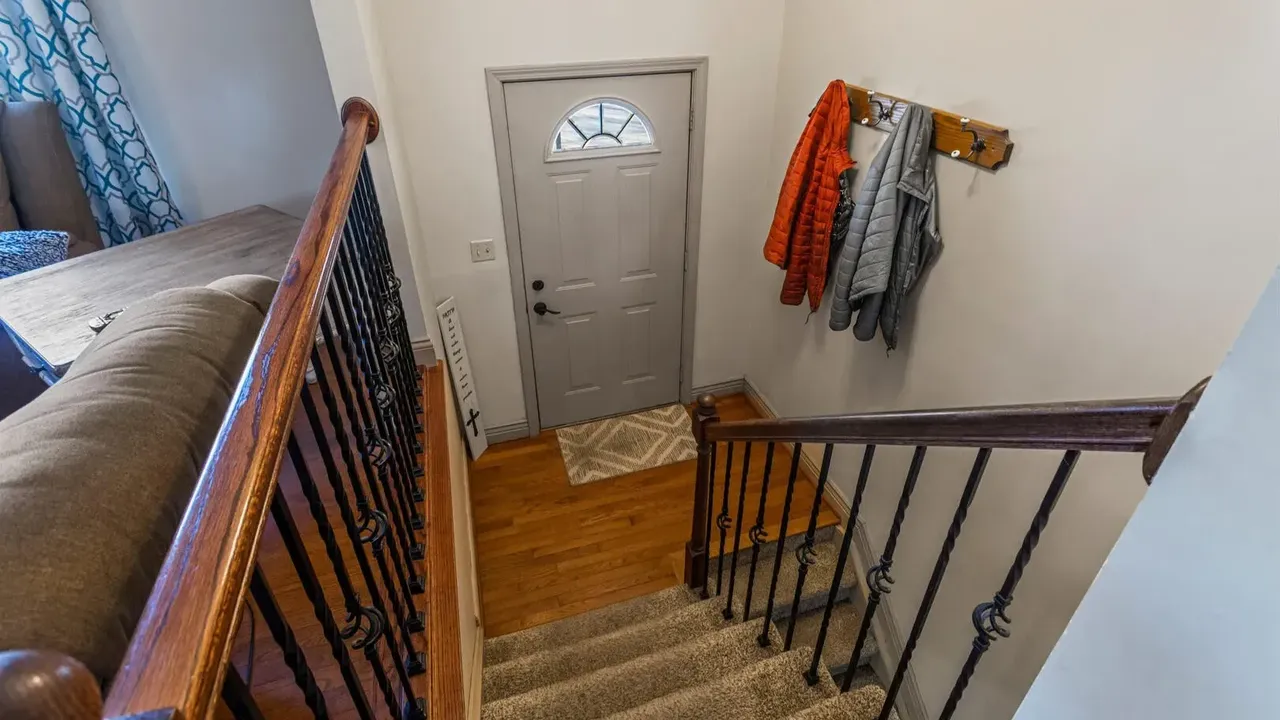 1978 Bi-Level Mahomet Residence With Remodeled Primary Suite and Wet Bar Lounge (With Floor Plan).