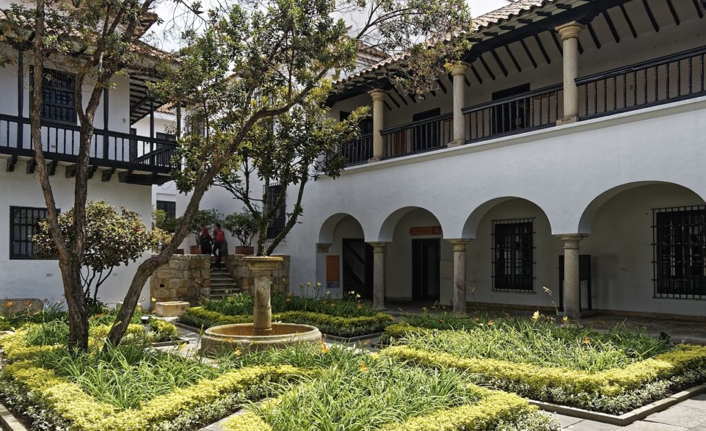 A Spanish courtyard with a garden.
