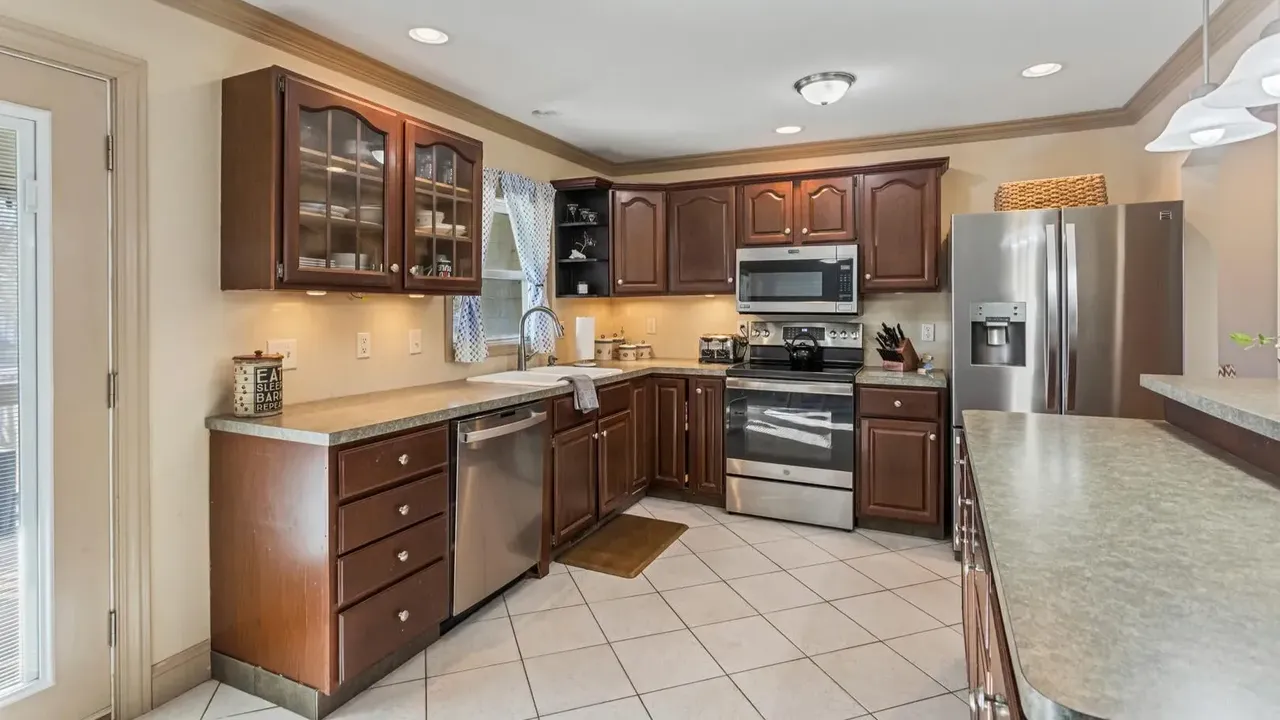 1978 Bi-Level Mahomet Residence With Remodeled Primary Suite and Wet Bar Lounge (With Floor Plan).