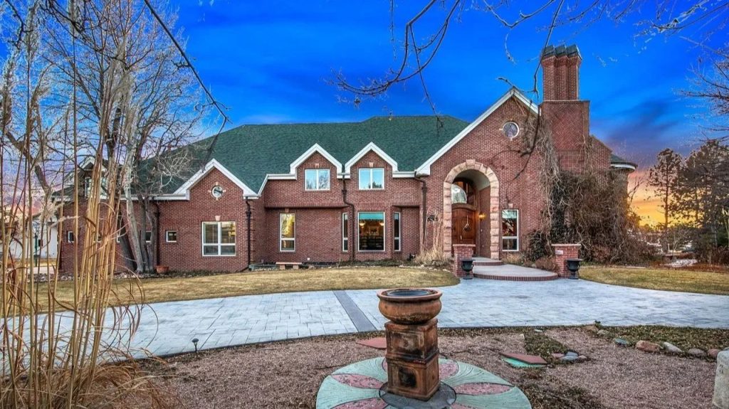 Get Inspired by This Grand 9,523 Sq-Ft Brick Manor in Fort Collins With Curved Staircase, Cherrywood Office, and Vaulted Ceilings