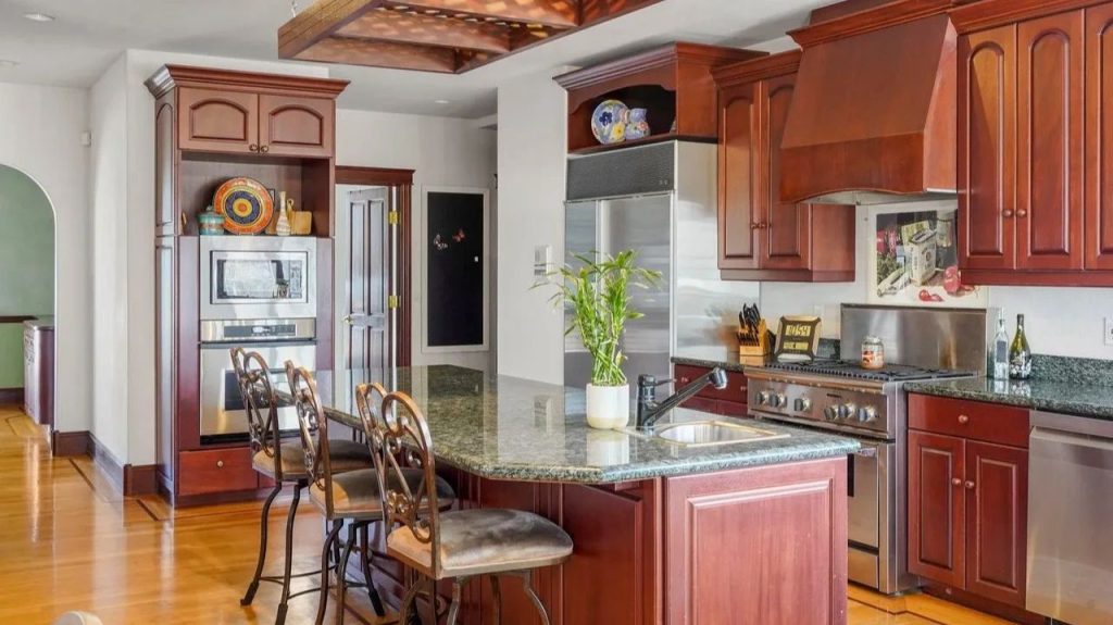 Get Inspired by This Grand 9,523 Sq-Ft Brick Manor in Fort Collins With Curved Staircase, Cherrywood Office, and Vaulted Ceilings