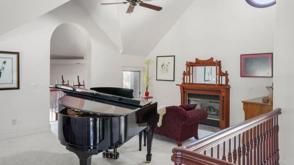 Get Inspired by This Grand 9,523 Sq-Ft Brick Manor in Fort Collins With Curved Staircase, Cherrywood Office, and Vaulted Ceilings