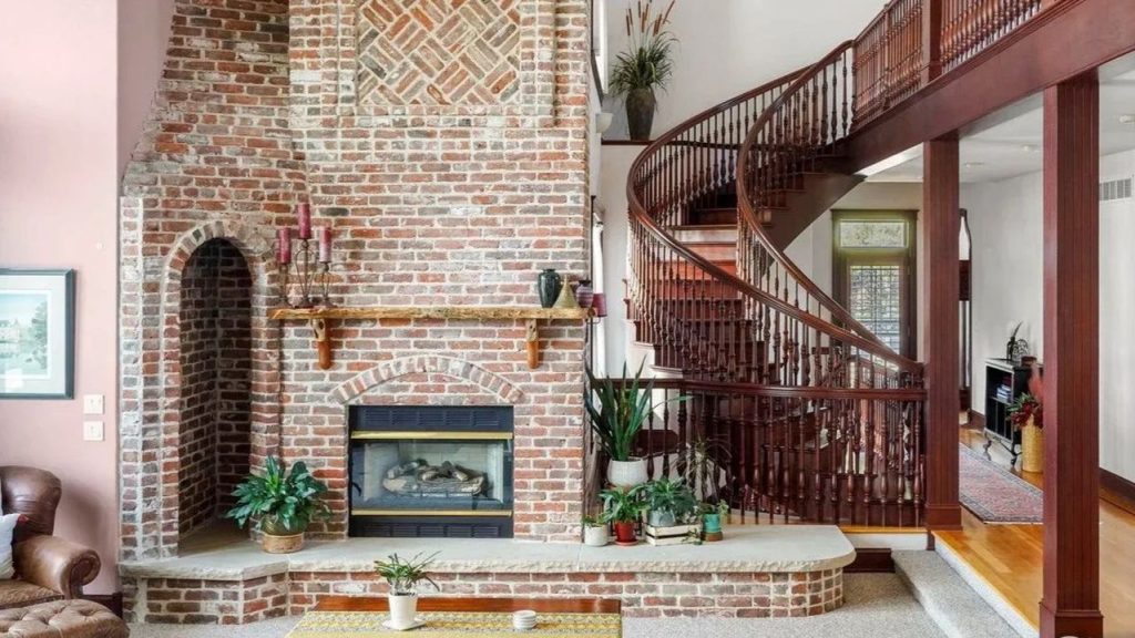 Get Inspired by This Grand 9,523 Sq-Ft Brick Manor in Fort Collins With Curved Staircase, Cherrywood Office, and Vaulted Ceilings