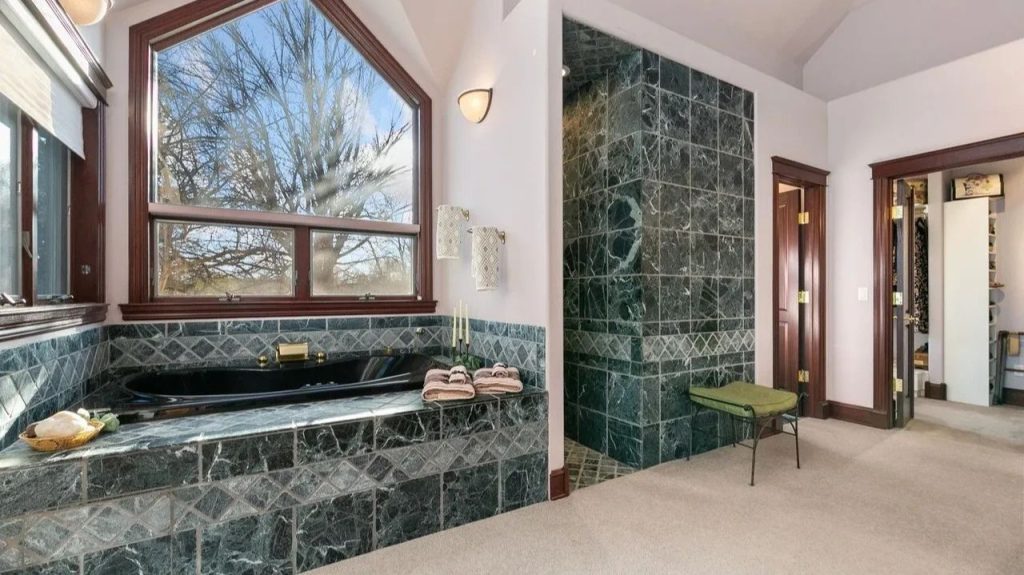 Get Inspired by This Grand 9,523 Sq-Ft Brick Manor in Fort Collins With Curved Staircase, Cherrywood Office, and Vaulted Ceilings