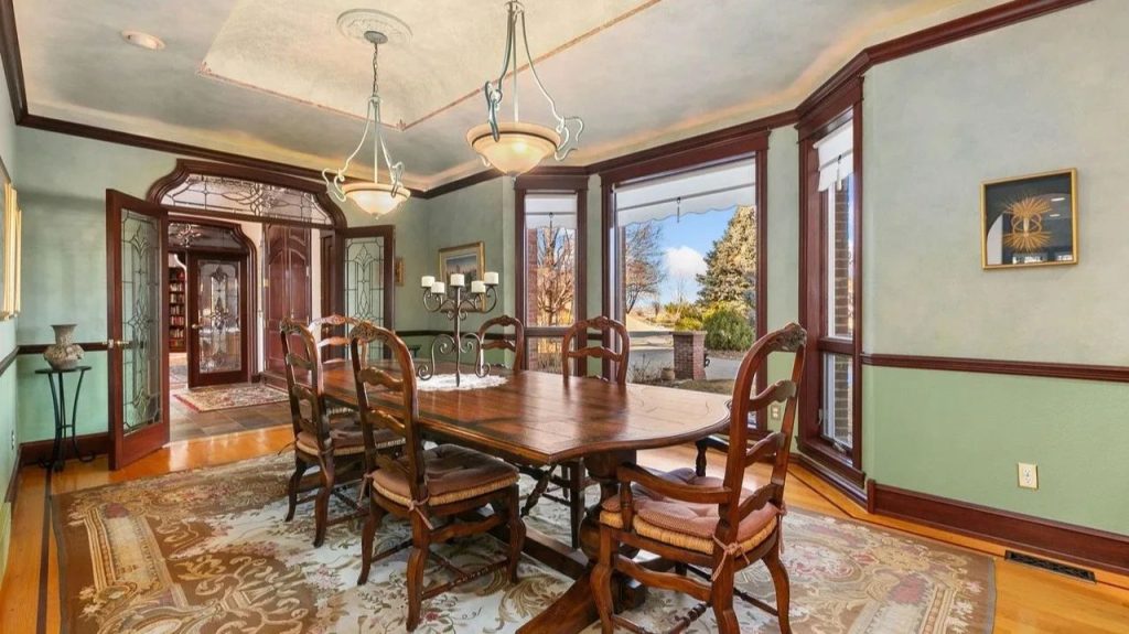 Get Inspired by This Grand 9,523 Sq-Ft Brick Manor in Fort Collins With Curved Staircase, Cherrywood Office, and Vaulted Ceilings