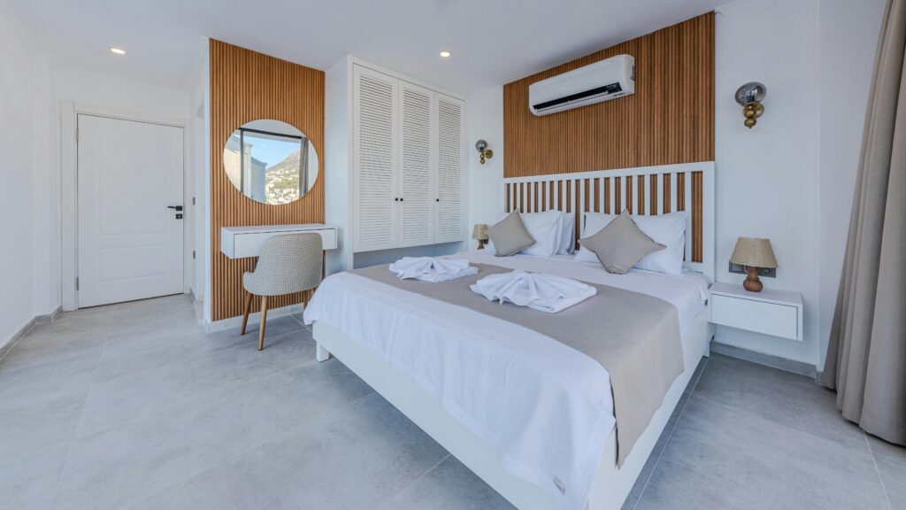Bedroom with white and wood tones.