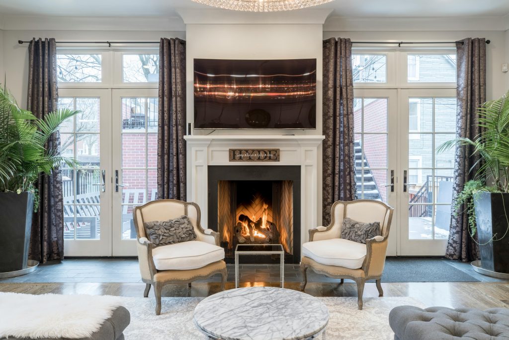 A room with an ornate fireplace.