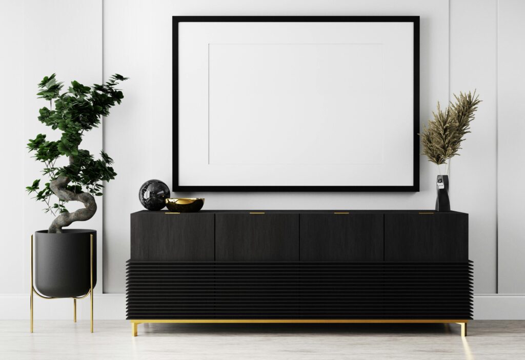 A black console with plants.