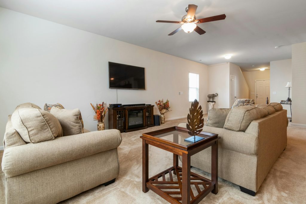 A living room with carpeted flooring.