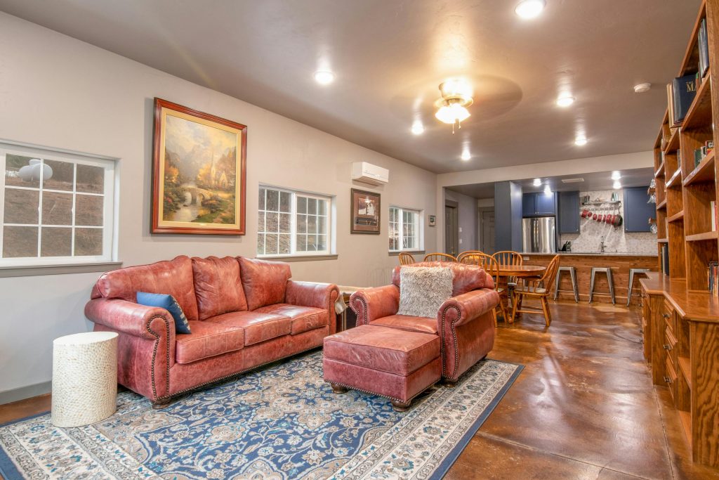 An old-looking living room with matching furniture.