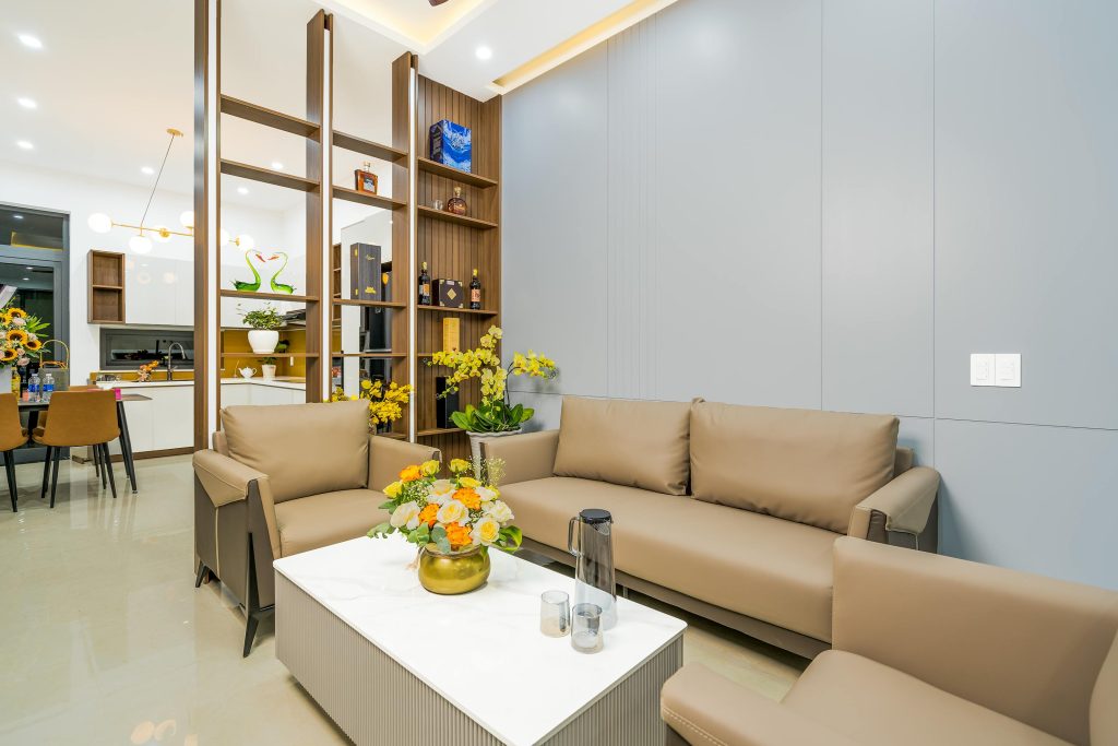 A living room with matching furniture and faux finishes.