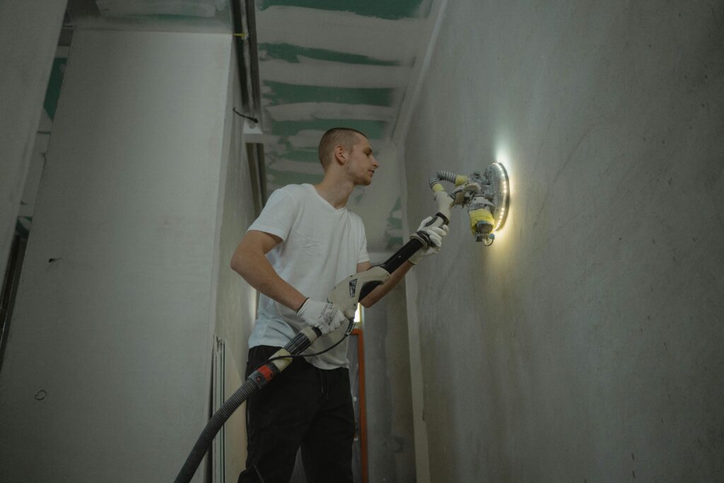 Man repairing a wall.