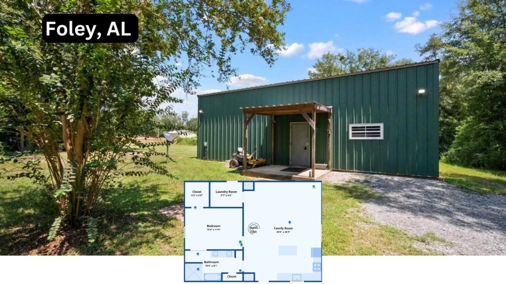 Green barndominium-style home with metal siding and a small front porch on a 4.8-acre lot in Foley, AL.