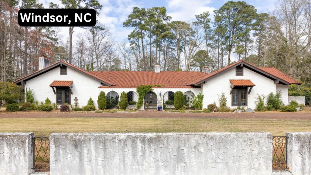 Spanish-style home with white stucco walls and a terracotta tile roof in Windsor, NC.