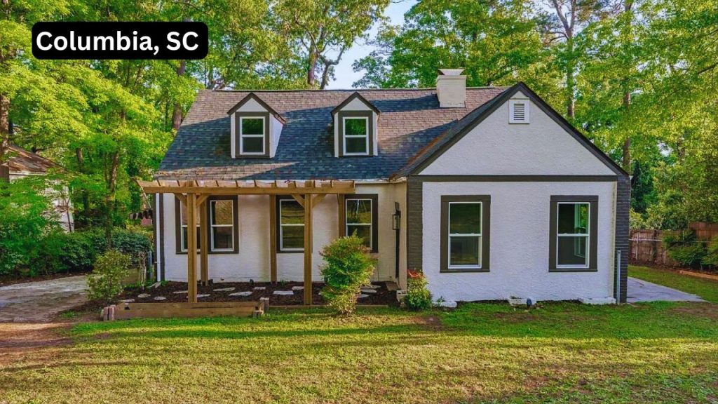 Updated white house with dark trim and dormer windows in Columbia, SC.