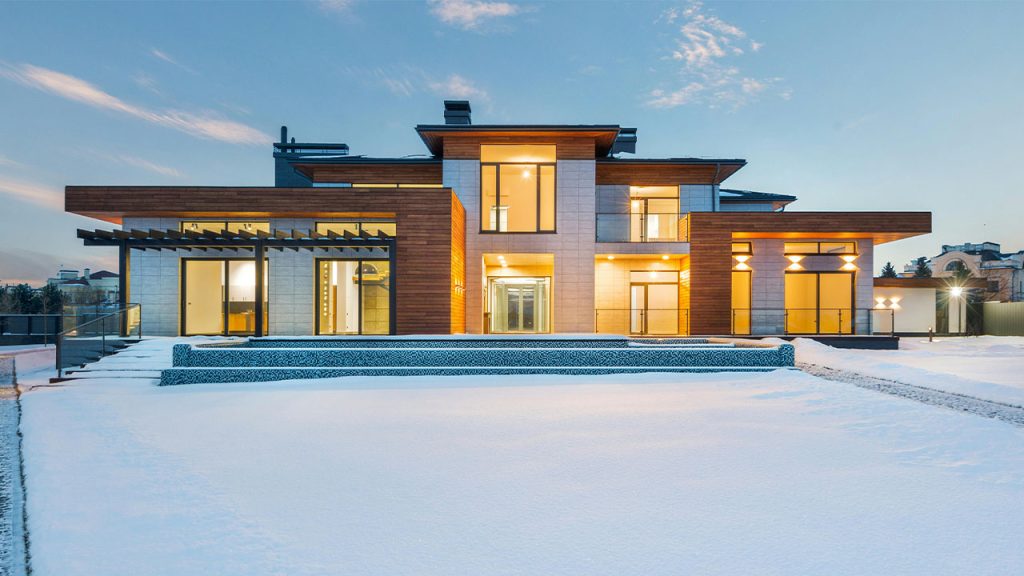 Modern villa with spacious yard in winter