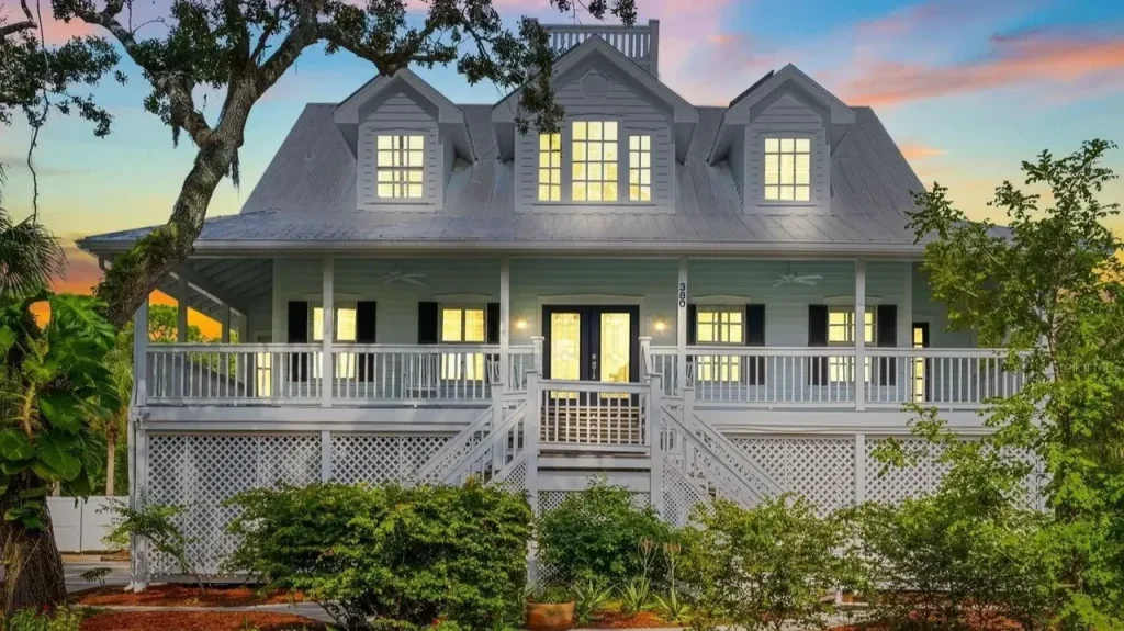 Tour This Stunning 1992 4-Bedroom Key West Style Home with Wraparound Porch in Oldsmar, FL (Floor Plan Included)