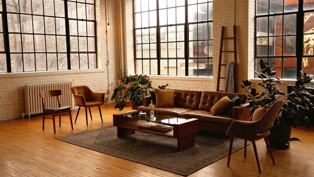 View of a Loft Style Living Room with a Brown, Leather Sofa