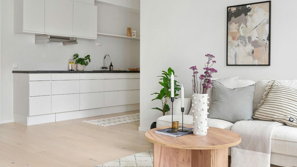 A living room filled with furniture and a white couch