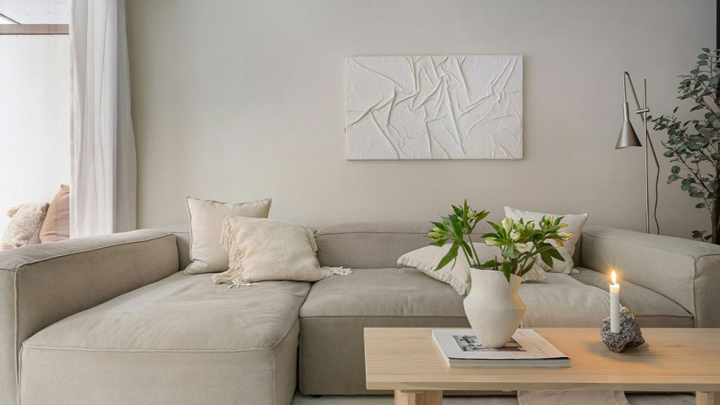 A living room filled with furniture and a large window