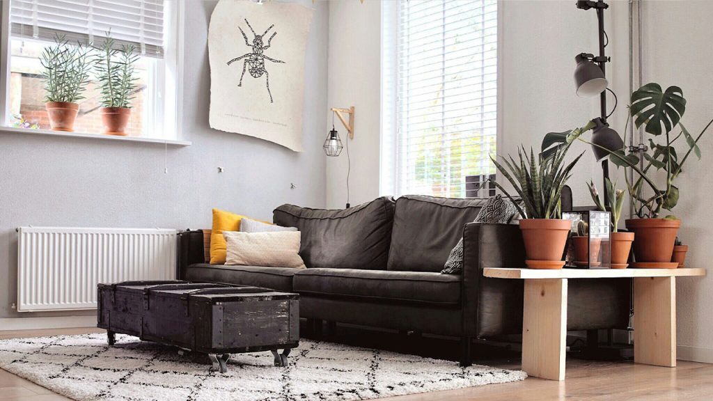 black two-seat sofa and coffee table inside room