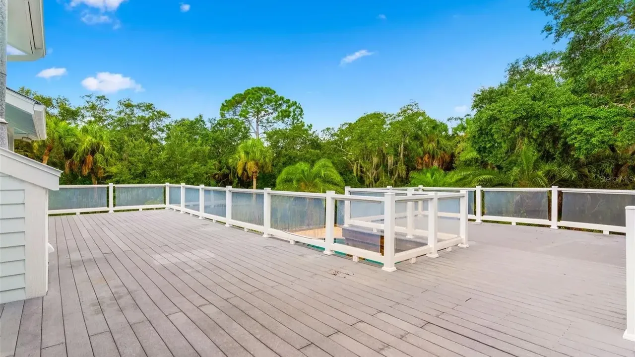 Tour This Stunning 1992 4-Bedroom Key West Style Home with Wraparound Porch in Oldsmar, FL (Floor Plan Included)