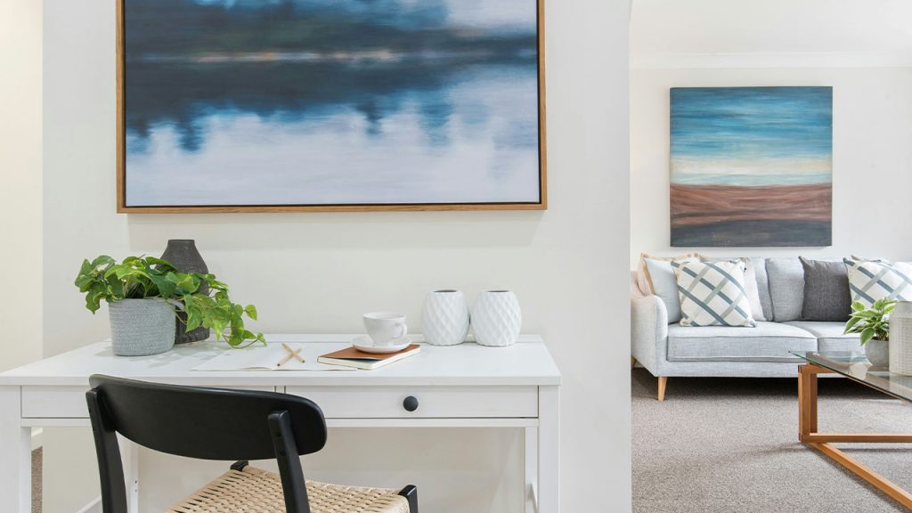 white and black table with chairs near body of water painting