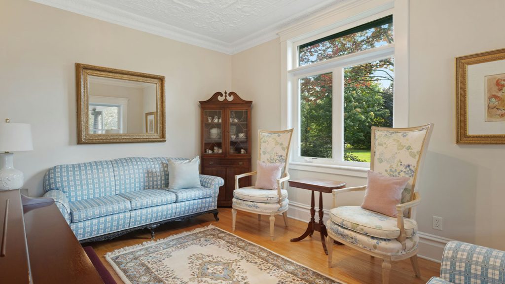 a living room filled with furniture and a large window