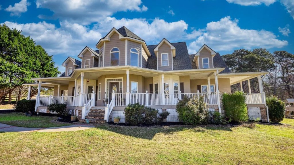 Wraparound porch with gables on a colonial-style home in Loganville.