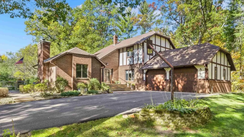 Experience Country Living in This 3-Bedroom Tudor with Garden and Wooded Trails in Stevens Point Wisconsin (Floor Plan Inside)