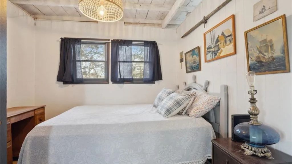 Rustic bedroom with vintage decor, wooden accents, and soft lighting.