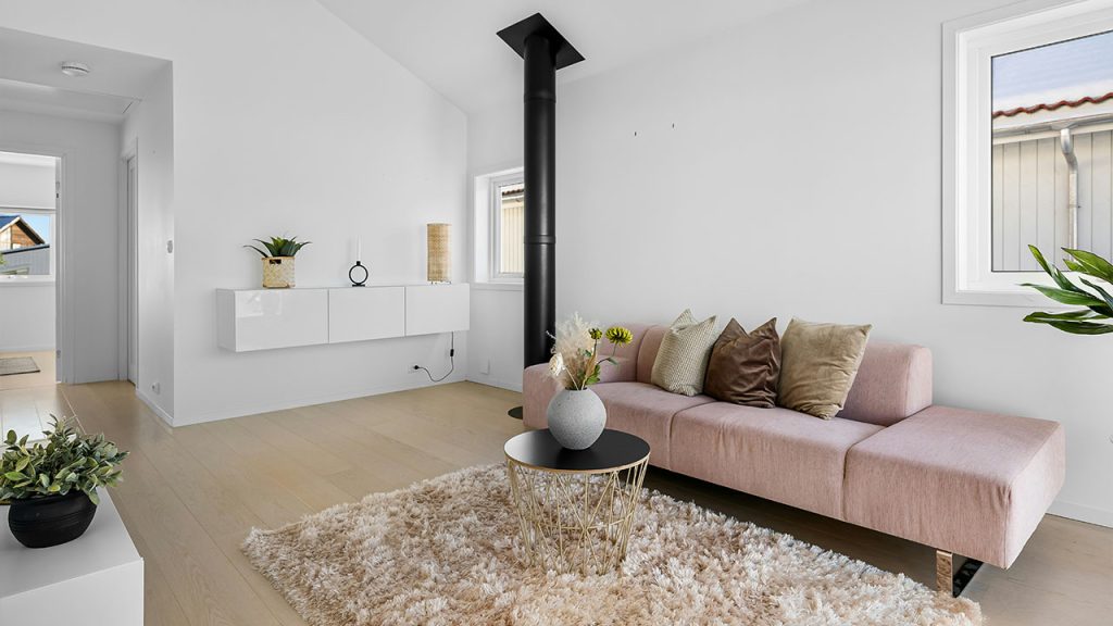 A living room filled with furniture and a large window