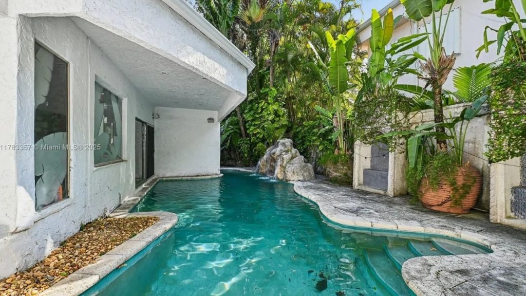 Tropical Pool Oasis with Waterfall