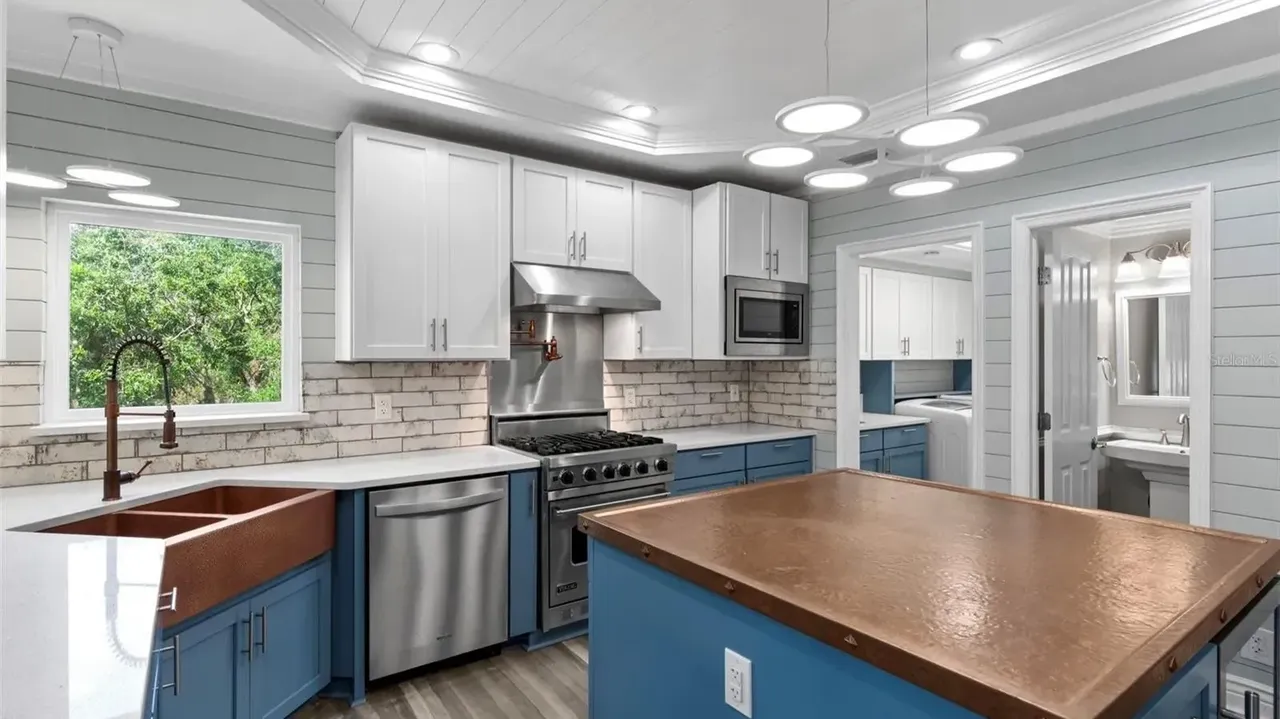 Tour This Stunning 1992 4-Bedroom Key West Style Home with Wraparound Porch in Oldsmar, FL (Floor Plan Included)