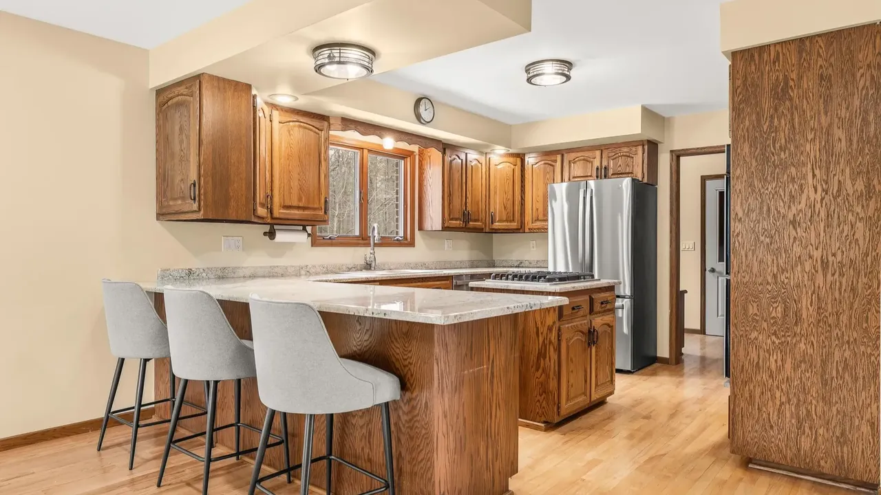 Experience Country Living in This 3-Bedroom Tudor with Garden and Wooded Trails in Stevens Point Wisconsin (Floor Plan Inside)