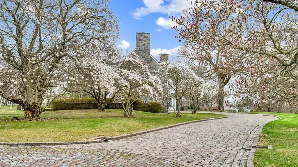 Tour This Majestic 1937 Estate in Greenwich with Tennis House, Ethereal Fountains, and 22 Acres of Beautifully Designed Land