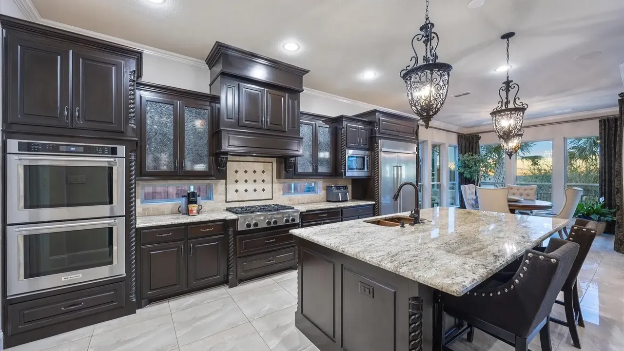 Explore This Elegant Mediterranean Retreat With Soaring Ceilings, Marble Floors, and Poolside Paradise (Floor Plan Inside)