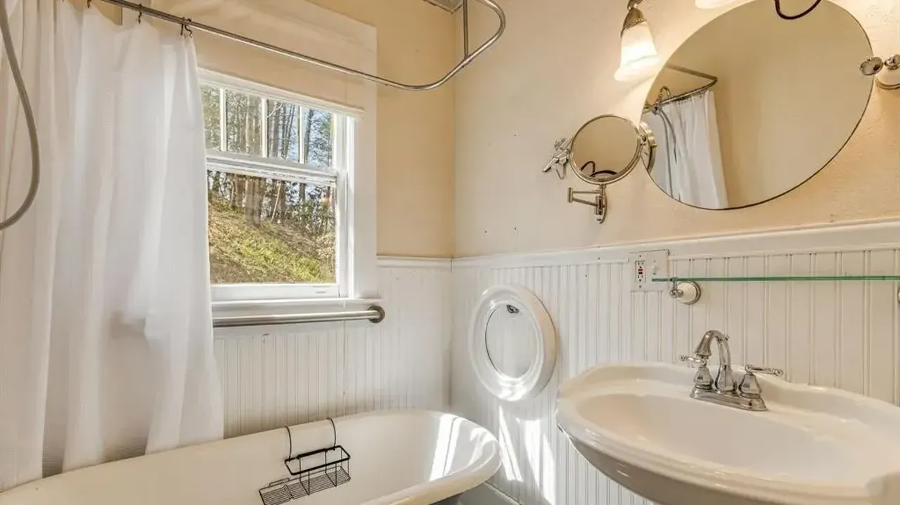 Tour This 1957 Farmhouse with Detached Garage Apartment Near Downtown Marshall, NC (Floor Plan Included)